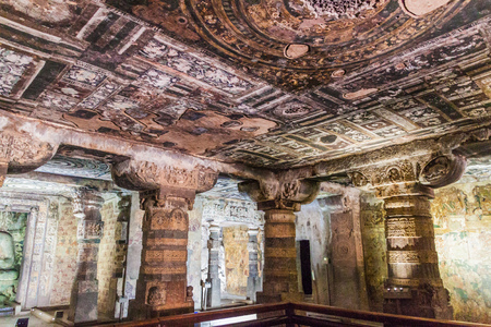 AJANTA, INDIA - FEBRUARY 6, 2017: Interior of a Buddhist cave carved into a cliff in Ajanta,...