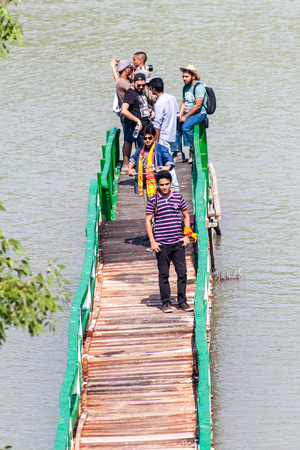 HIRON POINT, BANGLADESH - NOVEMBER 14, 2016: Tourists on a boardwalk at Hiron Point in Sundarbans, Bangladesh.のeditorial素材