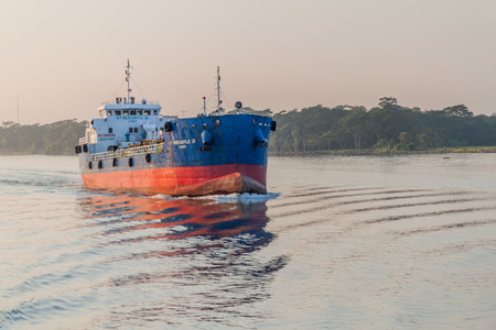 BISHKHALI RIVER, BANGLADESH - NOVEMBER 19, 2016: Cargo boat MT Mercantile 12 on Bishkhali River,...