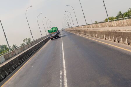 KHULNA, BANGLADESH - NOVEMBER 16, 2016: Traffic on Khan Jahan Ali Bridge over Rupsa River in Khulna, Bangladeshのeditorial素材