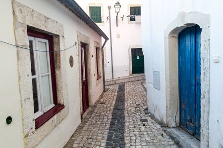 Narrow alleys in Alfama neighborhood of Lisbon, Portugalの写真素材