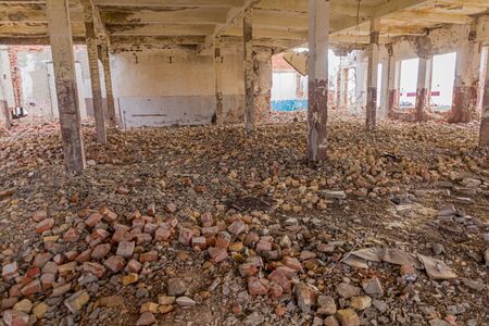 Ruins of abandoned fish canning factory in former Aral Sea port town Moynaq (Moâ€˜ynoq or...