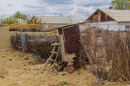Fence and a house in former port town Moynaq (Moâynoq or Muynak), Uzbekistanの写真素材