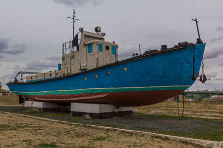 Exhibit of a fishing boatin former port town Moynaq (Moâynoq or Muynak), Uzbekistanのeditorial素材