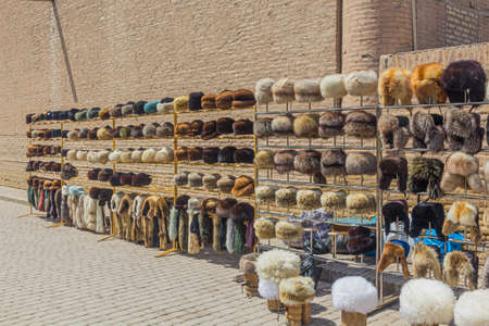 Fur hats for sale at the Pahlavon Mahmud street in the old town of Khiva, Uzbekistanのeditorial素材