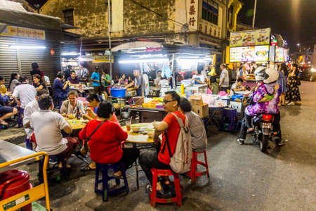 GEORGE TOWN, MALAYSIA - MARCH 20, 2018: Evening view of outdoor food stalls in George Town, Malaysiaのeditorial素材