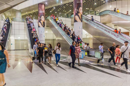 SINGAPORE, SINGAPORE - MARCH 12, 2018: Escalators at Dhoby Ghaut MRT interchange station in Singaporeのeditorial素材