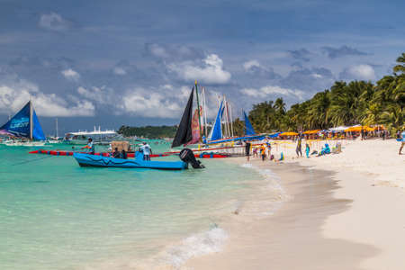 BORACAY, PHILIPPINES - FEBRUARY 1, 2018: Sail boats at the White Beach at Boracay island, Philippinesのeditorial素材