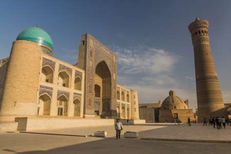 BUKHARA, UZBEKISTAN - APRIL 30, 2018: Mir-i-Arab Madrasa and Kalan minaret in Bukhara, Uzbekistanのeditorial素材