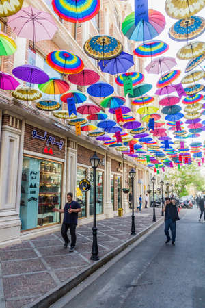 TEHRAN, IRAN - APRIL 3, 2018: Alley with colorful umbrellas in the center of Tehran, Iran