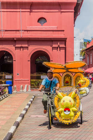 MALACCA, MALAYASIA - MARCH 19, 2018: Colorful rickshaw in the center of Malacca (Melaka).のeditorial素材