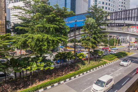 KUALA LUMPUR, MALAYSIA - MARCH 30, 2018: Foot bridge over Sultan Ismail street in Kuala Lumpur,...