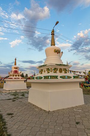 Stupas and flags near Syakusn Syume, Geden Sheddup Choikorling Monastery, Tibetan Buddhist monastery in Elista, Republic of Kalmykia, Russiaの写真素材