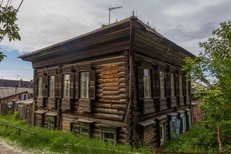 Typical Russian wooden house in Tyumen city, Russiaの写真素材