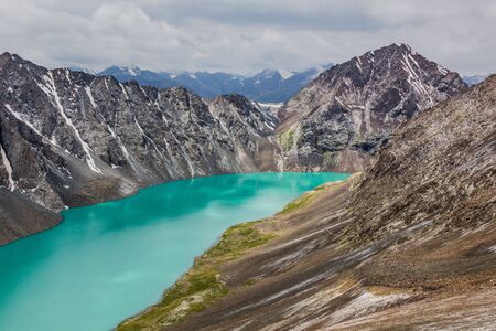 Ala-Kul lake in the Terskey Alatau mountain range in Kyrgyzstanの写真素材