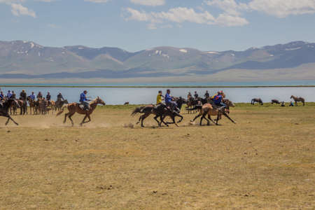 SONG KOL, KYRGYZSTAN - JULY 25, 2018: Locals play kok boru (ulak tartysh), traditional horse game, with a goat carcass, at the National Horse Games Festival at the shores of Son Kol Lakeのeditorial素材