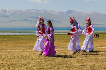SONG KOL, KYRGYZSTAN - JULY 25, 2018: Traditional dress wearing girls during the National Horse...