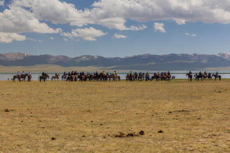 SONG KOL, KYRGYZSTAN - JULY 25, 2018: Players of kok boru (ulak tartysh), traditional horse game, with a goat carcass, at the National Horse Games Festival at the shores of Son Kol Lakeのeditorial素材