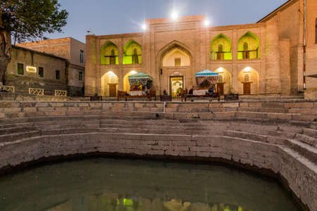 BUKHARA, UZBEKISTAN - MAY 1, 2018: Small pond with a restaurant in the center of Bukhara, Uzbekistan