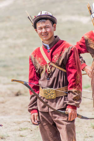 ISSYK KUL, KYRGYZSTAN - JULY 15, 2018: Local archer at the Ethnofestival Teskey Jeek at the coast of Issyk Kul lake in Kyrgyzstanのeditorial素材