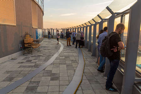 YEKATERINBURG, RUSSIA - JULY 3, 2018: Vysotskiy Viewing Platform in Yekaterinburg during the sunset,...