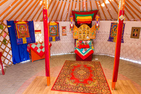 ELISTA, RUSSIA - JUNE 27, 2018: Interior of a Buddhist religious yurt in the Ethnical village museum...
