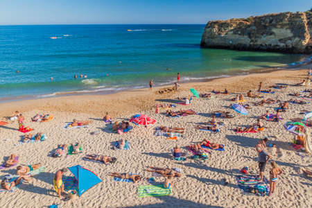 LAGOS, PORTUGAL - OCTOBER 7, 2017: People at Praia da Batata beach near Lagos, Portugal.のeditorial素材