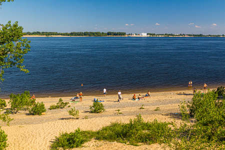 VOLGOGRAD, RUSSIA - JUNE 28, 2018: People at a beach at Volga river in Volgograd, Russiaの写真素材