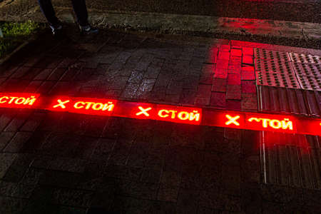 Light sign stop (written in Russian) at the pedestrian crossing