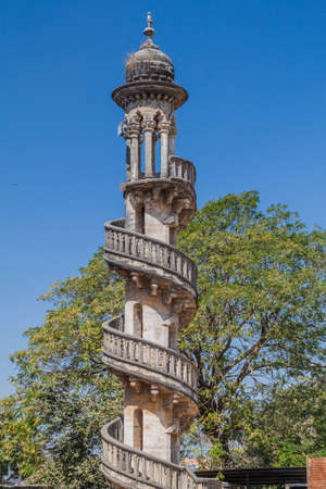 Minaret of the tomb of Bahar-ud-din Bhar in Junagadh, Gujarat state, Indiaの写真素材