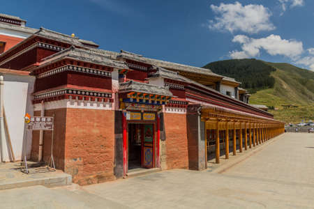 Row of prying wheels at Labrang Monastery in Xiahe town, Gansu province, China