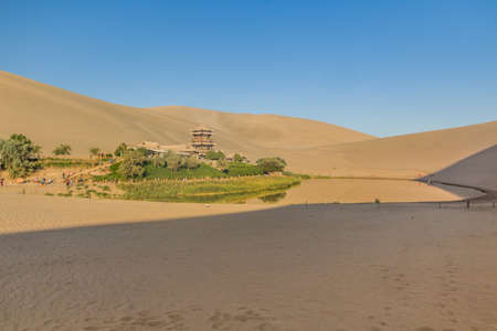 Crescent Moon Lake at Singing Sands Dune near Dunhuang, Gansu Province, Chinaの写真素材
