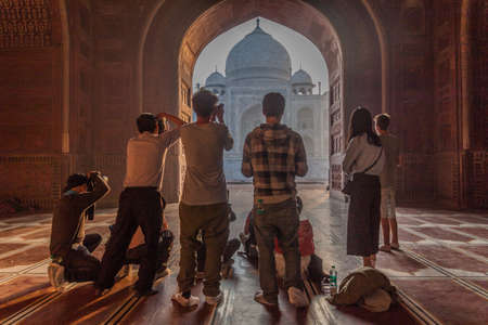 AGRA, INDIA - FEBRUARY 19, 2017: Several photograhers take pictures of Taj Mahal.のeditorial素材