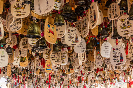 ZHANGYE, CHINA - AUGUST 23, 2018: Wish bells at a pavilion in Zhangye Danxia National Geopark, Gansu Province, Chinaのeditorial素材