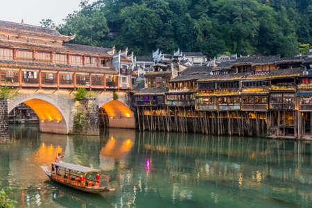 FENGHUANG, CHINA - AUGUST 13, 2018: Hong bridge over Tuo river in Fenghuang Ancient Town, Hunan...