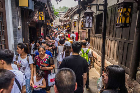 CHONGQING, CHINA - AUGUST 17, 2018: Crowded alley in Ciqikou Ancient Town, Chinaのeditorial素材