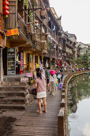 FENGHUANG, CHINA - AUGUST 14, 2018: Riverside path in Fenghuang Ancient City, Hunan province, Chinaのeditorial素材