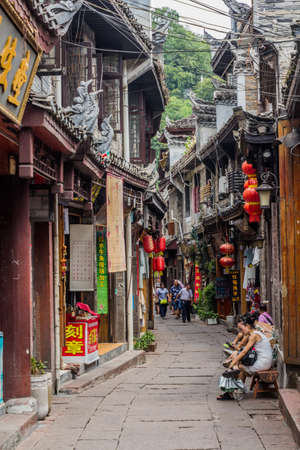 FENGHUANG, CHINA - AUGUST 14, 2018: Narrow alley with lanterns in Fenghuang Ancient City, Hunan province, Chinaのeditorial素材