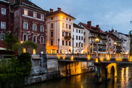 Evening view of the Cobblers bridge in Ljubljana, Sloveniaの写真素材