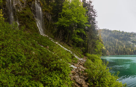 Waterfall and a hiking trail around Crno jezero lake in Durmitor mountains, Montenegroの写真素材