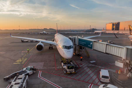 BRUSSELS, BELGIUM - NOV 4, 2018: Sunrise view of an airplane at Brussels Airport, Belgiumのeditorial素材