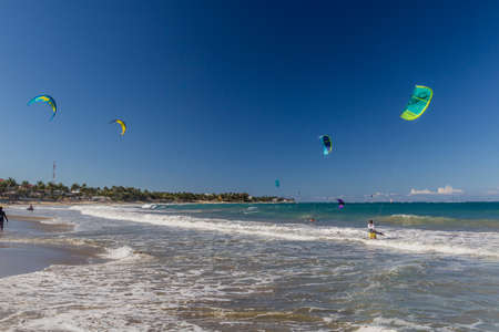 CABARETE, DOMINICAN REPUBLIC - DECEMBER 13, 2018: Kitesurfing on a beach in Cabarete, Dominican Republicのeditorial素材