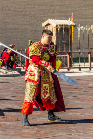 JIAYUGUAN, CHINA - AUGUST 22, 2018: Traditionally dressed fighter in Jiayuguan Fort, Gansu Province, Chinaのeditorial素材
