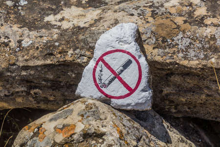 No smoking sign in Gobustan petroglyph reserve, Azerbaijanの写真素材