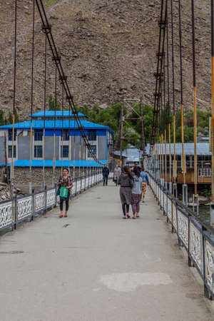 KHOROG, TAJIKISTAN - MAY 21, 2018: Hanging bridge over Gunt river in Khorog town, Tajikistanのeditorial素材