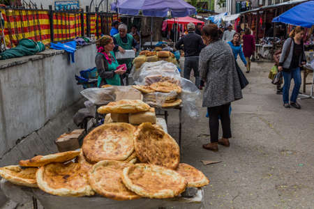 KHOROG, TAJIKISTAN - MAY 21, 2018: Bread stall at bazaar in Khorog town, Tajikistanのeditorial素材