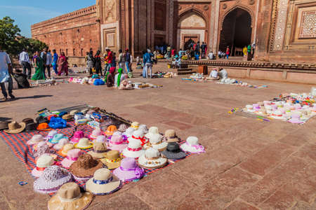 FATEHPUR SIKRI, INDIA - FEBRUARY 17, 2017: Tourists and vendors at Buland Darwaza (Victory Gate) of the ancient city Fatehpur Sikri, Uttar Pradesh state, Indiaのeditorial素材