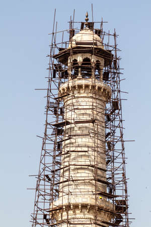 Minaret of Taj Mahal in Agra under scaffolding, Indiaの写真素材