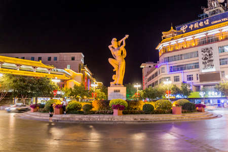 DUNHUANG, CHINA - AUGUST 19, 2018: Evening view of flying Apsara statue in Dunhuang, Gansu Province, Chinaのeditorial素材