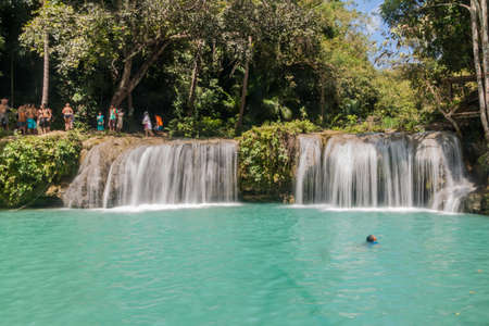 SIQUIJOR, PHILIPPINES - FEBRUARY 9, 2018: People enjoy Cambugahay Falls on Siquijor island, Philippines.のeditorial素材